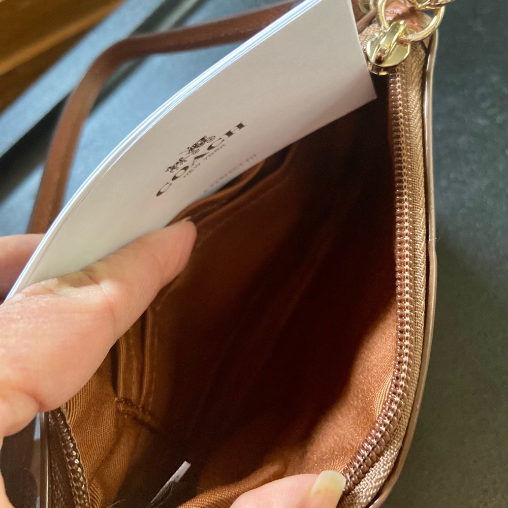 Never used brown 4” x 6” Coach wristlet!
